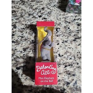 Balancing Act Mini Elephant‎ On Ball